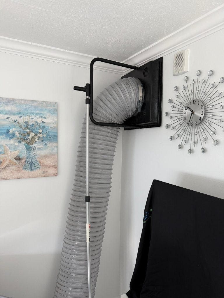 Air duct cleaning professional with vacuum equipment